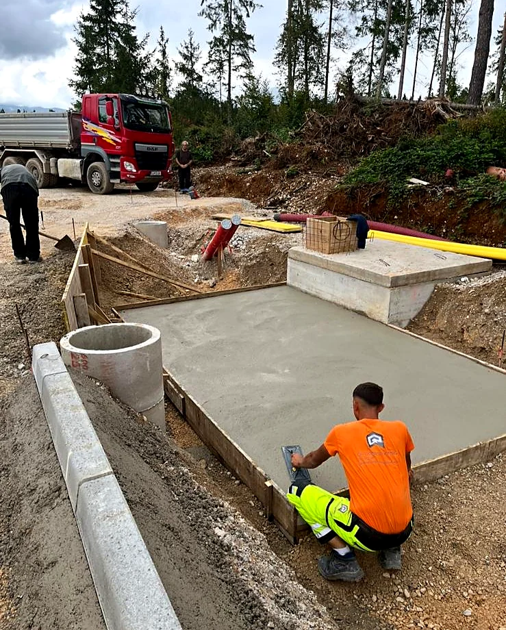 Concrete pad with worker